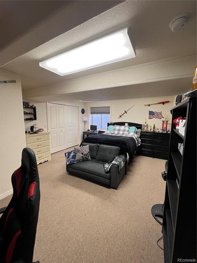 825 Cherokee St, Strasburg, CO 80136 - carpeted bedroom featuring a closet and a textured ceiling