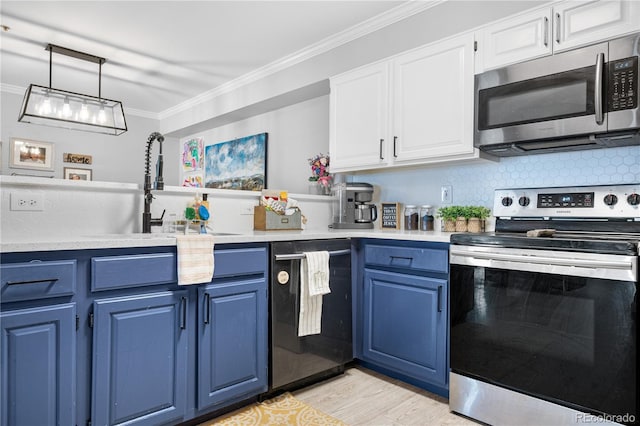 kitchen featuring stainless steel appliances, crown molding, white cabinetry, decorative light fixtures, and blue cabinets