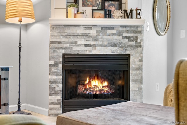 details with a stone fireplace