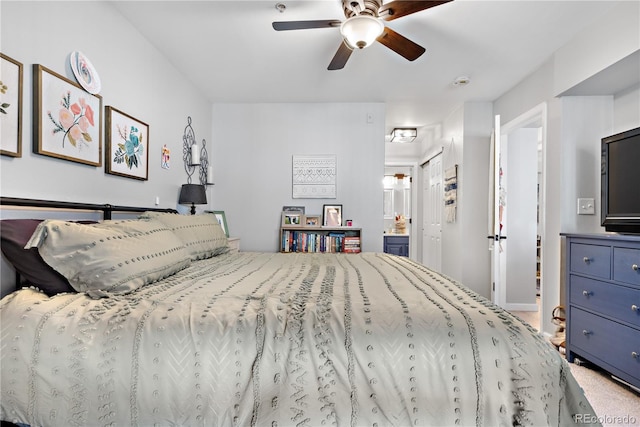 bedroom featuring ensuite bath, carpet floors, ceiling fan, and a closet