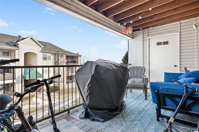 view of patio / terrace with grilling area and a balcony