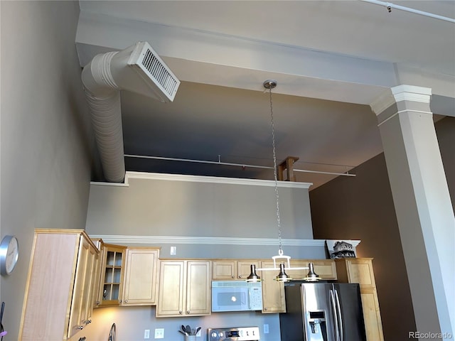 1555 California St Unit 302, Denver, CO 80202 - kitchen featuring white microwave, stainless steel fridge with ice dispenser, light brown cabinets, glass insert cabinets, and pendant lighting