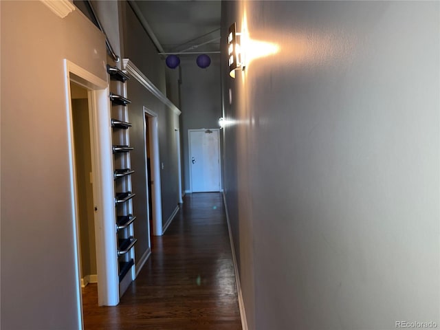 1555 California St Unit 302, Denver, CO 80202 - hallway featuring dark wood-style floors and baseboards