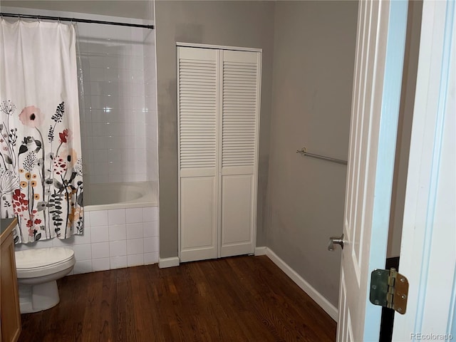 1555 California St Unit 302, Denver, CO 80202 - bathroom featuring wood finished floors, tiled shower / bath combo, and a closet