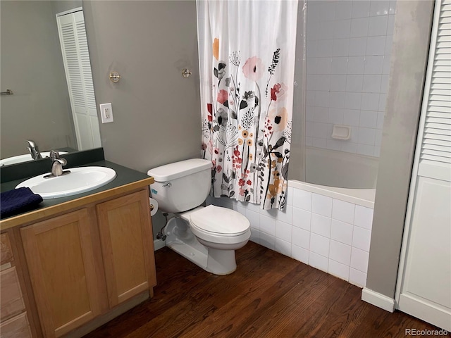 1555 California St Unit 302, Denver, CO 80202 - bathroom featuring tiled shower / bath combo, vanity, wood finished floors, and a closet