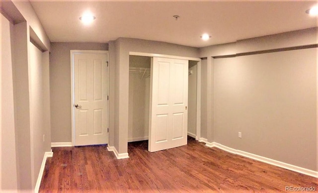 1555 California St Unit 302, Denver, CO 80202 - unfurnished bedroom with wood finished floors, recessed lighting, and a closet