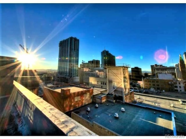 1555 California St Unit 302, Denver, CO 80202 - patio terrace at dusk featuring a city view