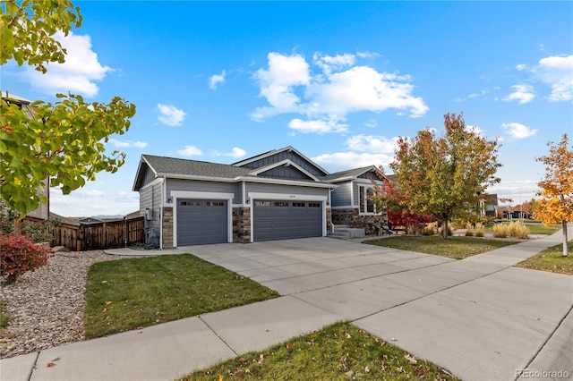 view of front of house with a front lawn and a garage