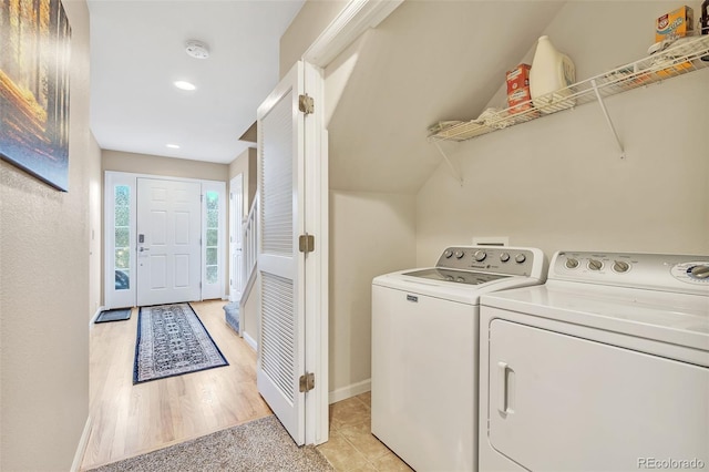 laundry area with washing machine and dryer, laundry area, and baseboards