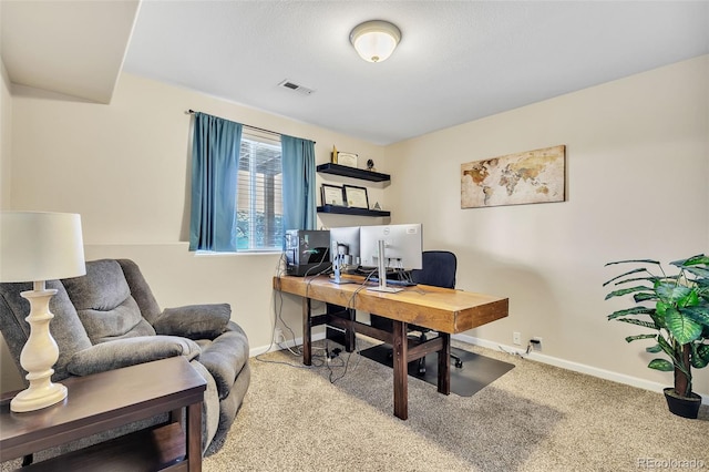 carpeted office with visible vents and baseboards