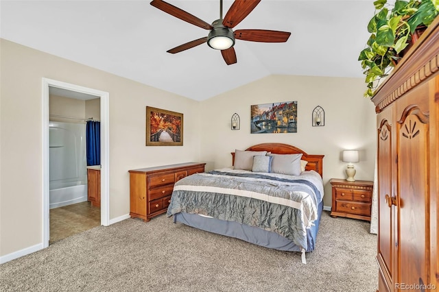 bedroom with baseboards, a ceiling fan, connected bathroom, lofted ceiling, and light colored carpet