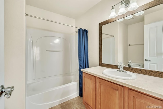 full bathroom featuring tile patterned flooring, shower / bath combo with shower curtain, and vanity