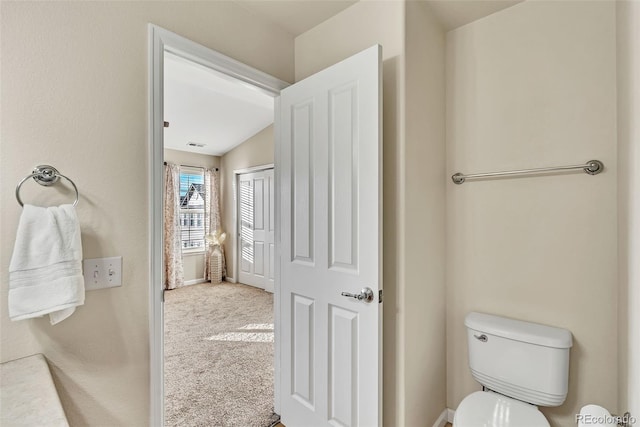 bathroom featuring visible vents and toilet