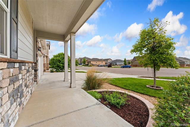 15525 Quince Cir, Thornton, CO 80602 - porch with a residential view and a yard