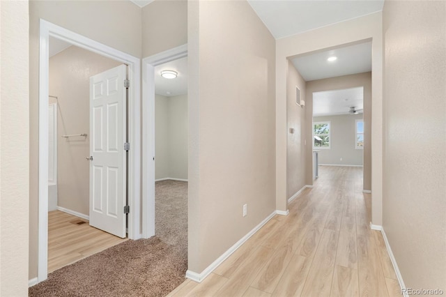 15525 Quince Cir, Thornton, CO 80602 - hallway featuring wood finished floors and baseboards