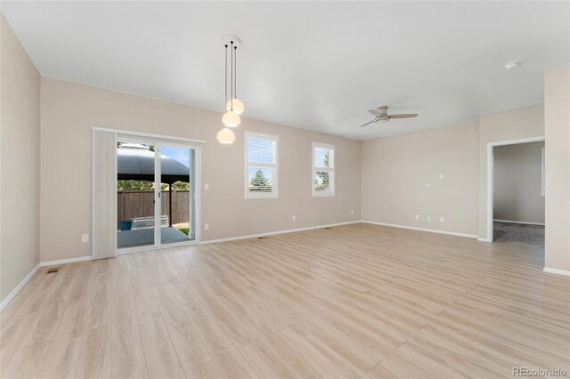 15525 Quince Cir, Thornton, CO 80602 - spare room with ceiling fan, light wood-type flooring, baseboards, and a smoke detector