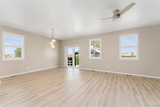15525 Quince Cir, Thornton, CO 80602 - unfurnished room featuring light wood-style floors, a ceiling fan, and baseboards