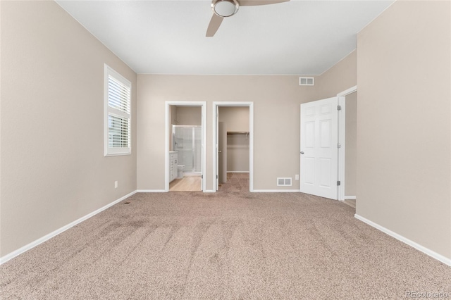 15525 Quince Cir, Thornton, CO 80602 - unfurnished bedroom featuring a spacious closet, carpet floors, baseboards, a closet, and ceiling fan