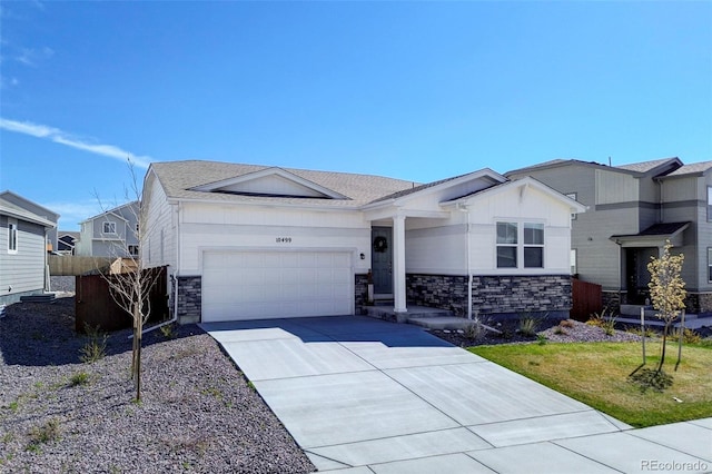 10499 Rolling Peaks Dr, Peyton, CO 80831 - ranch-style home with stone siding, an attached garage, driveway, and fence