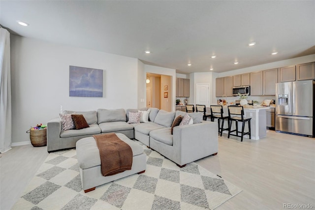 10499 Rolling Peaks Dr, Peyton, CO 80831 - living area with recessed lighting and light wood-type flooring
