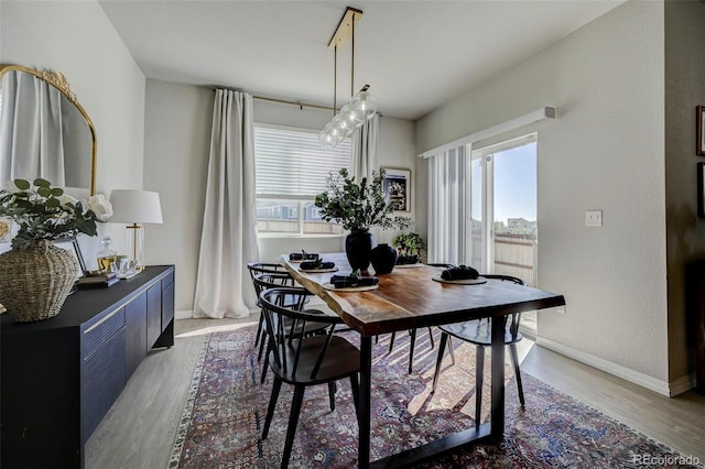 10499 Rolling Peaks Dr, Peyton, CO 80831 - dining space with wood finished floors and baseboards