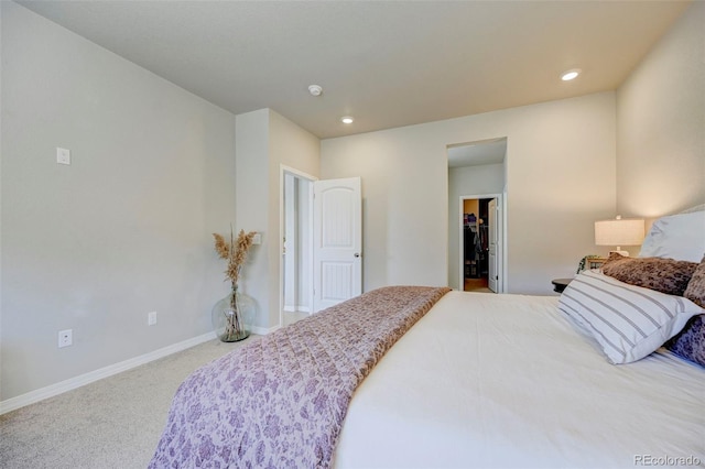 10499 Rolling Peaks Dr, Peyton, CO 80831 - carpeted bedroom featuring a walk in closet, baseboards, and recessed lighting