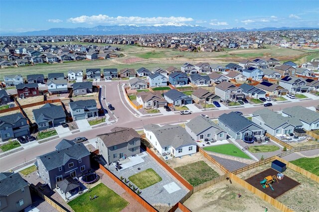 10499 Rolling Peaks Dr, Peyton, CO 80831 - aerial perspective of suburban area featuring mountains