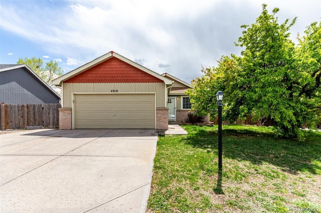 4318 Suncreek Dr, Loveland, CO 80538 - craftsman-style home featuring brick siding, an attached garage, fence, and driveway