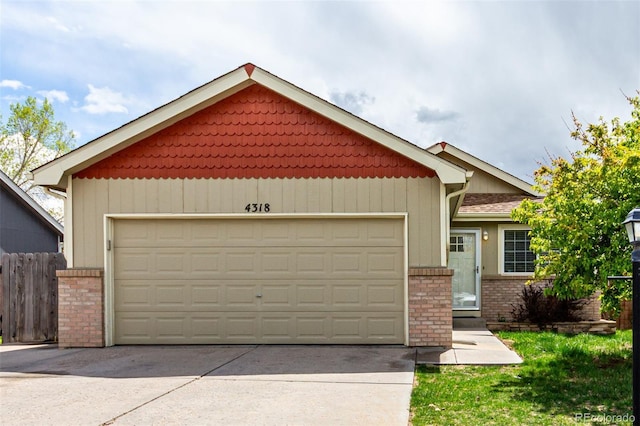 4318 Suncreek Dr, Loveland, CO 80538 - craftsman house with brick siding, fence, and a garage