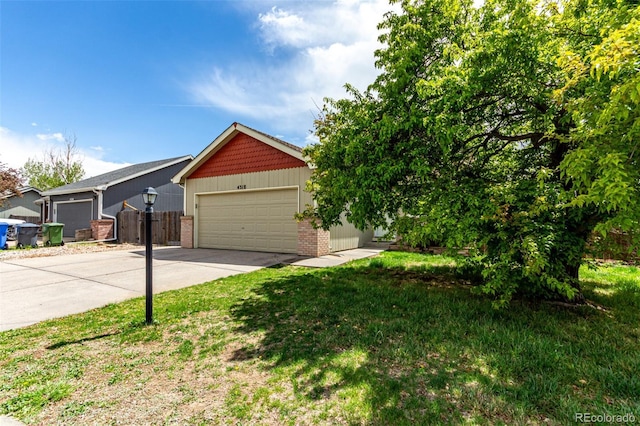 4318 Suncreek Dr, Loveland, CO 80538 - view of front of house featuring concrete driveway, brick siding, fence, and a front lawn