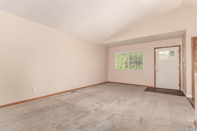 4318 Suncreek Dr, Loveland, CO 80538 - unfurnished room with baseboards, visible vents, light carpet, and lofted ceiling