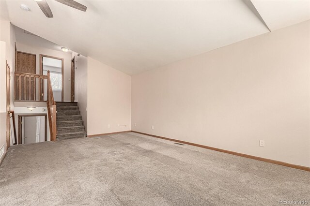 4318 Suncreek Dr, Loveland, CO 80538 - unfurnished living room featuring carpet floors, ceiling fan, baseboards, and stairs