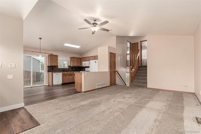4318 Suncreek Dr, Loveland, CO 80538 - kitchen featuring baseboards, open floor plan, a ceiling fan, and white appliances