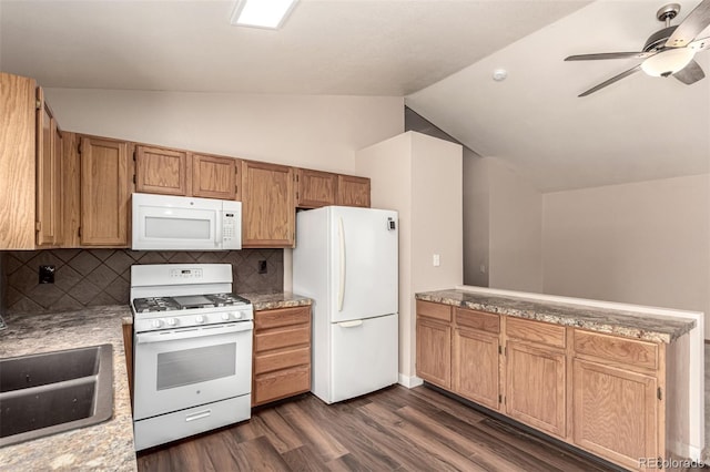 4318 Suncreek Dr, Loveland, CO 80538 - kitchen featuring dark wood-style flooring, vaulted ceiling, a sink, a peninsula, and white appliances