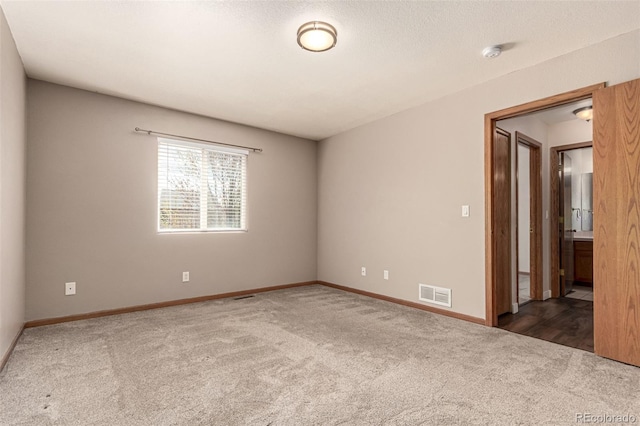 4318 Suncreek Dr, Loveland, CO 80538 - empty room with visible vents, baseboards, and carpet floors