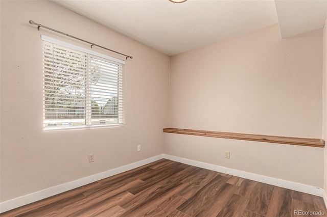 4318 Suncreek Dr, Loveland, CO 80538 - spare room featuring dark wood-style flooring and baseboards