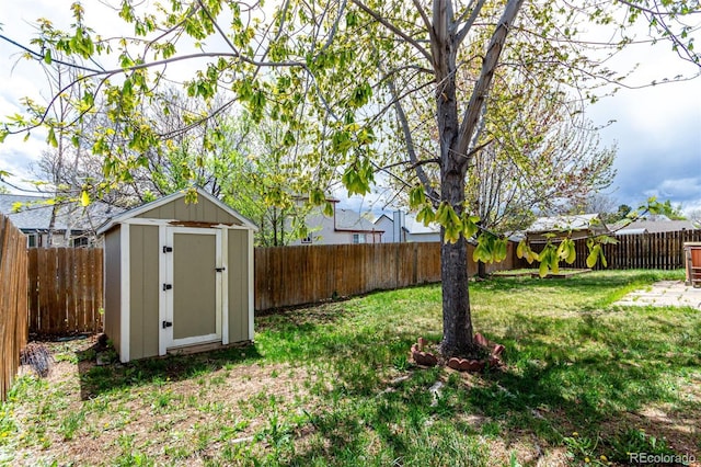4318 Suncreek Dr, Loveland, CO 80538 - view of yard with a fenced backyard, a storage unit, and an outbuilding