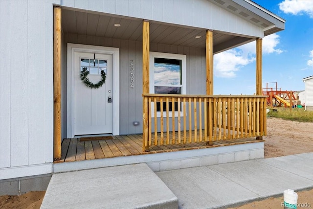 view of exterior entry featuring a porch