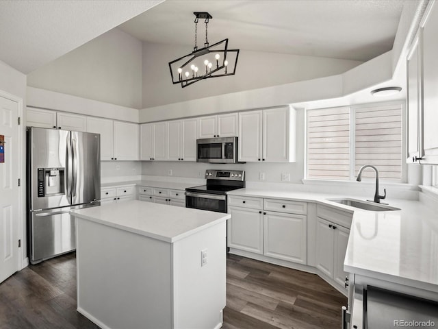6055 W Progress Ave, Littleton, CO 80123 - kitchen featuring stainless steel appliances, high vaulted ceiling, white cabinets, a kitchen island, and light countertops