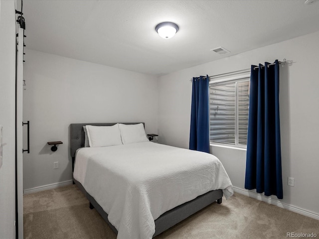 6055 W Progress Ave, Littleton, CO 80123 - carpeted bedroom featuring baseboards