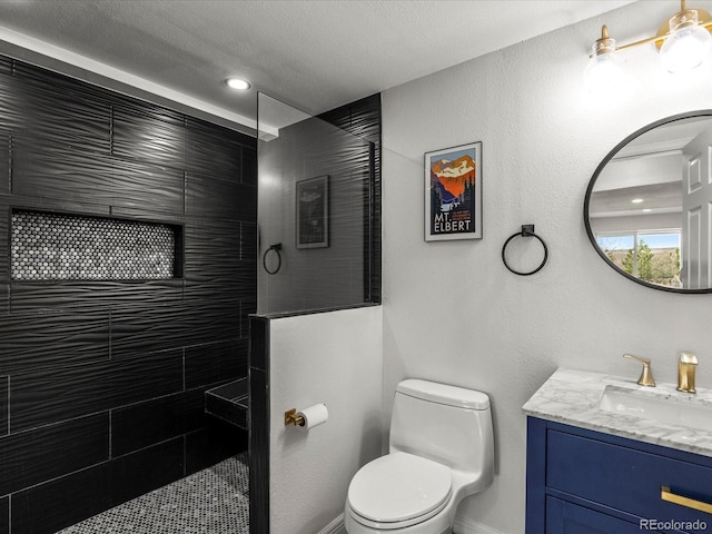 6055 W Progress Ave, Littleton, CO 80123 - full bathroom featuring vanity, walk in shower, and a textured ceiling