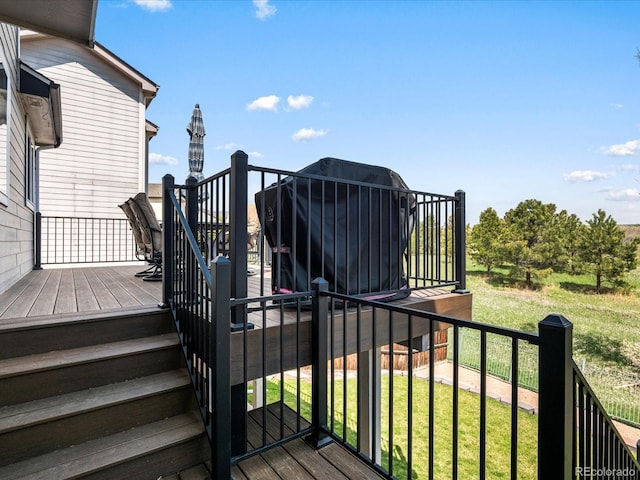 6055 W Progress Ave, Littleton, CO 80123 - deck with stairs and a yard