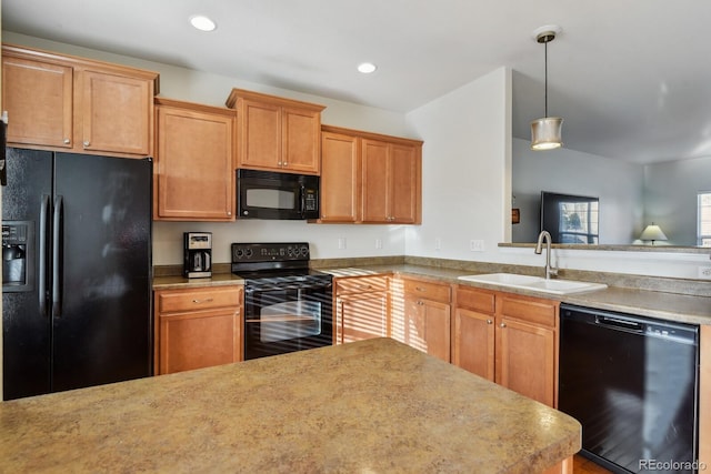 kitchen with black appliances, sink, and pendant lighting