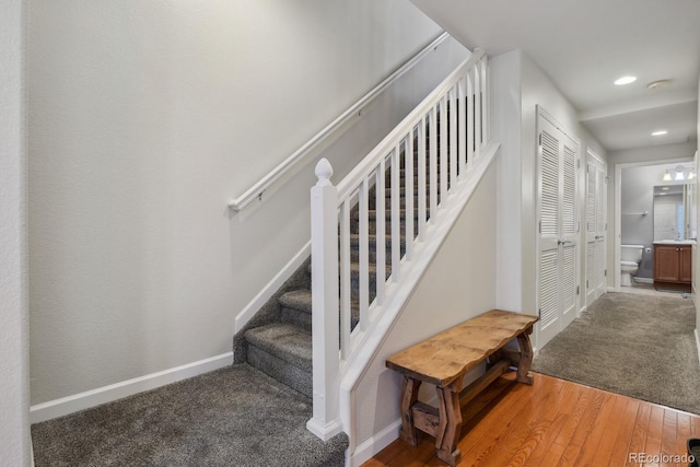 staircase featuring hardwood / wood-style floors