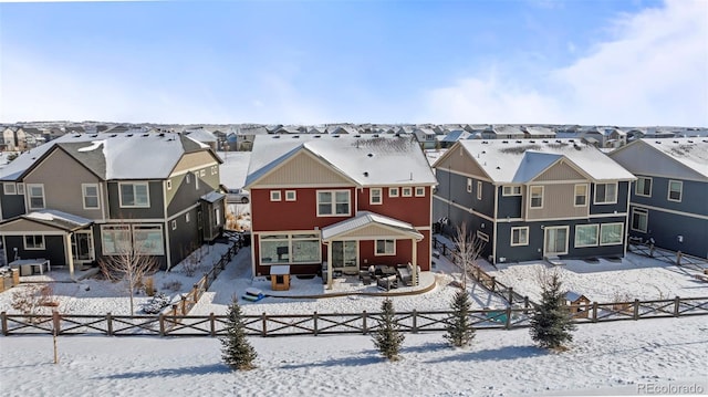 view of snow covered house