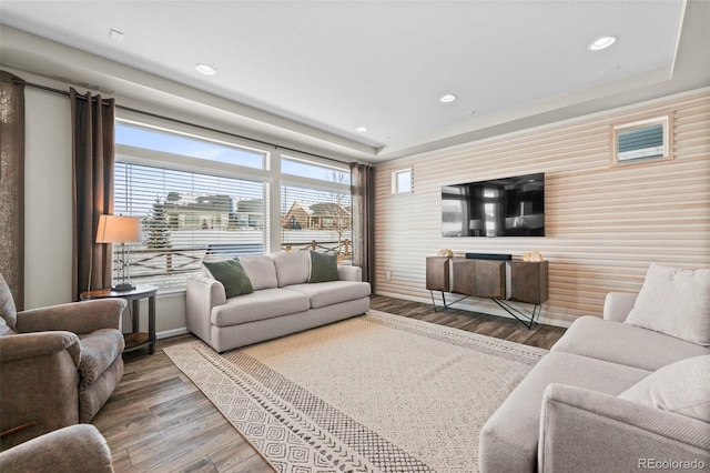 living room featuring a healthy amount of sunlight and hardwood / wood-style flooring