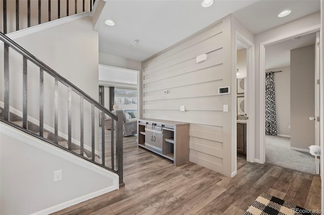 entryway with dark hardwood / wood-style flooring