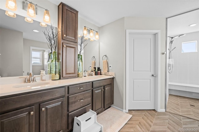 bathroom featuring a shower, parquet flooring, and vanity