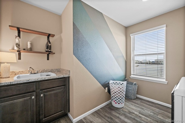 bathroom featuring hardwood / wood-style floors and vanity