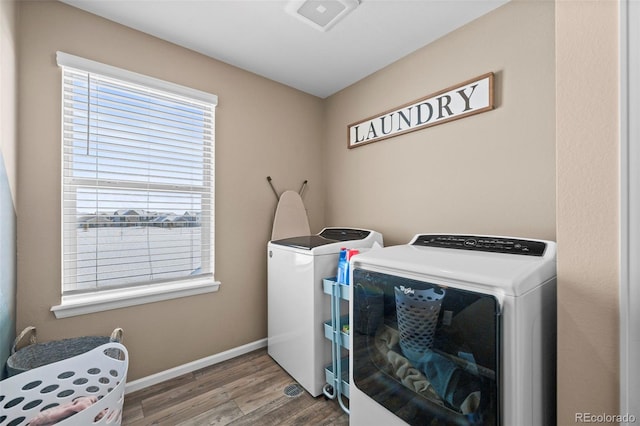 washroom featuring hardwood / wood-style floors and independent washer and dryer